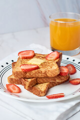 French toast garnished with strawberries. Healthy morning breakfast.