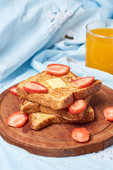 French toast with strawberries and honey, healthy breakfast.
