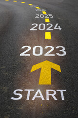 Start to new year from 2023 to 2027 with arrow marking on road. Five years startup business concept...