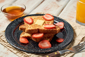 French toast garnished with strawberries. Healthy morning breakfast.