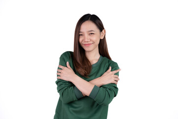 Young business woman hugs herself, smiling carefree and happy isolated on white background.