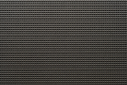 Black speaker lattice background or texture, closeup. Abstract metallic mesh texture pattern for background