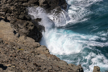 wave breaking on rocks