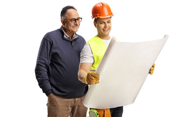Construction worker showing a plan to a mature man