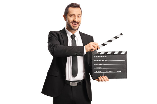 Man in suit and tie holding a movie clapperboard