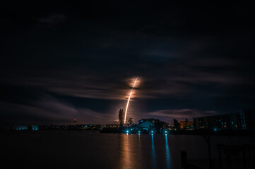 Fototapeta na wymiar Rocket Lighting up Night Sky