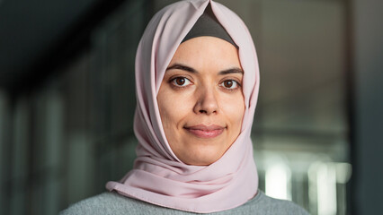 Woman looking at camera and wearing a hijab