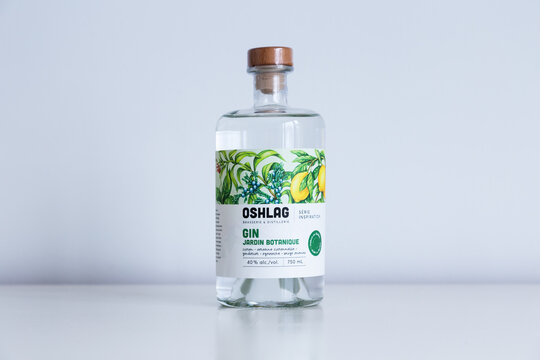 Quebec City, Quebec, Canada, December 1, 2022 - Bottle of small batch Montreal produced Oshlag Gin Jardin Botanique set on plain grey background