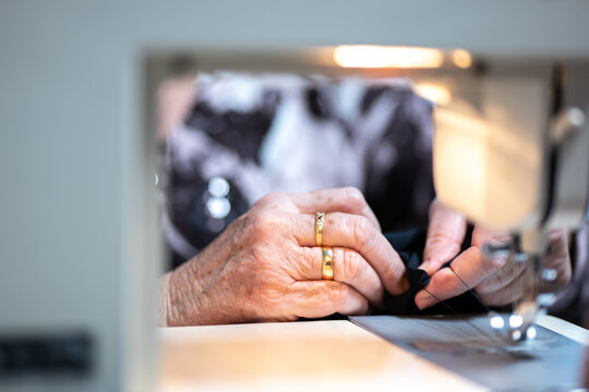 Senior tailors using sewing machine
