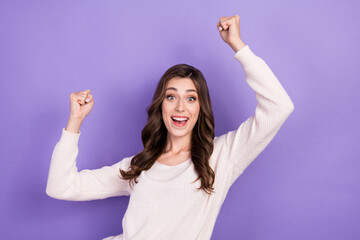 Photo of funky excited woman brunette hairstyle raise hands celebrate finally weekend holidays after work isolated on pastel violet color background