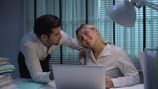 Young Caucasian woman was harassed by a male supervisor at work while she was working overtime at night.