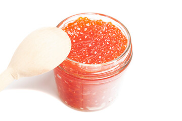 Glass jar with delicious red caviar isolated on white background.