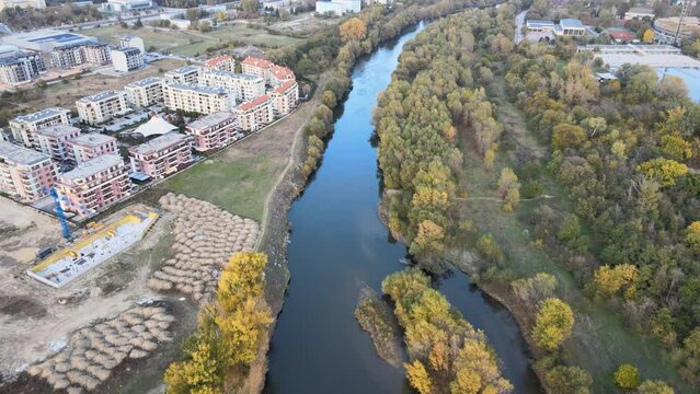 Drone air shot of Bulholme Lock on Aire and Calder navigation trees apartment block around