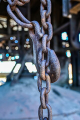 Old rusty chain with chain links in the World Heritage Völklingen Ironworks, Völklingen, Saarland, Germany
