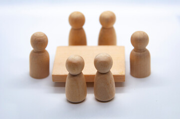 Wooden figure having meeting with white background. Meeting concept