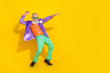 Fototapeta na wymiar Full length photo of good mood positive guy dressed violet velvet jacket having disco fun empty space isolated yellow color background