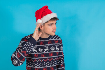 isolated young man with christmas clothes