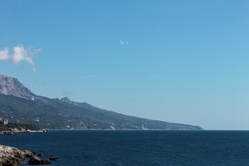 Mountains and forest near the sea shore at summer