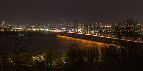Bridge over the river and the city lights at the night