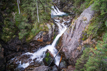 Mickiewicz waterfall near the road to Morskie Oko lake. Zakopane, Tatra Mountains National park, Poland. - obrazy, fototapety, plakaty