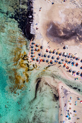 Aerial drone shot of beautiful turquoise beach with pink sand Elafonissi, Crete, Greece. Best beaches of Mediterranean, Elafonissi beach, Crete, Greece. Famous Elafonisi beach on Greece island, Crete.