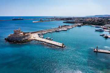 Mandraki port with deers statue, where The Colossus was standing and fort of St. Nicholas. Rhodes,...
