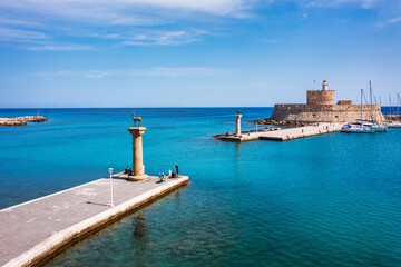 Mandraki port with deers statue, where The Colossus was standing and fort of St. Nicholas. Rhodes,...