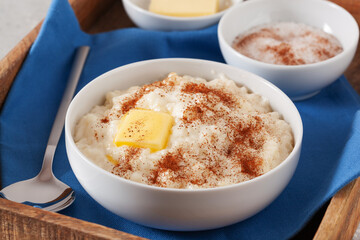 rice pudding with butter cinnamon. french riz au lait, norwegian risgrot, traditional breakfast...
