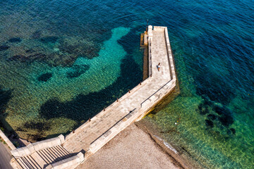 Kaiser Wilhelm's bridge and walkway a stone swim platform in Corfu, Greece