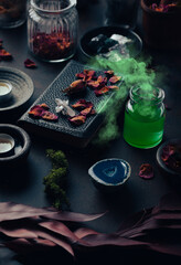Witchcraft still life concept with smoking potion, spell book, herbs ingredients candles and magical equipment