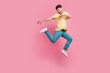 Full length photo of millennial boy battle fighting practicing martial arts ninja look empty space isolated on pink color background