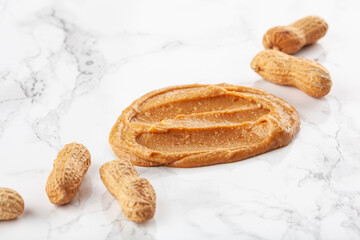 peanut butter on white marble background