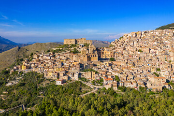 Fototapeta na wymiar Caccamo, Sicily. Medieval Italian city with the Norman Castle in Sicily mountains, Italy. View of Caccamo town on the hill with mountains in the background, Sicily, Italy.