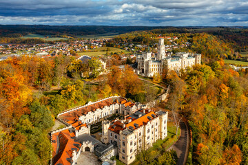 Castle Hluboka nad Vltavou is one of the most beautiful castles in Czech Republic. Castle Hluboka nad Vltavou in autumn with red foliage, Czechia. Colorful autumn view of Hluboka nad Vltavou castle.