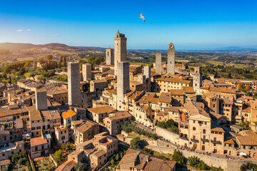 Town of San Gimignano, Tuscany, Italy with its famous medieval towers. Aerial view of the medieval village of San Gimignano, a Unesco World Heritage Site. Italy, Tuscany, Val d'Elsa. - obrazy, fototapety, plakaty