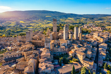 Town of San Gimignano, Tuscany, Italy with its famous medieval towers. Aerial view of the medieval village of San Gimignano, a Unesco World Heritage Site. Italy, Tuscany, Val d'Elsa. - 550658477