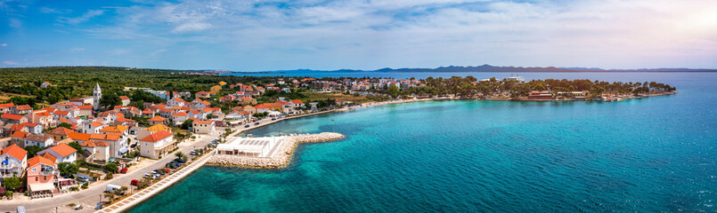 Fototapeta na wymiar Petrcane village tourist destination coastline aerial panoramic view, Dalmatia region of Croatia. Aerial top view of village Petrcane, Croatia. Petrcane aerial view, Dalmatia region of Croatia