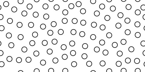 Simple black rings scattered throughout the seamless canvas. Vector print for various interior design or decor.