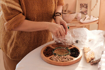 Herbal tea collection. Glass jars with lids. Master class on cooking, training. The hands of the...