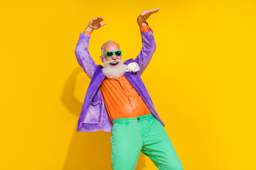 Photo portrait of attractive grandpa dance have fun celebrate retirement dressed stylish colorful look isolated on yellow color background