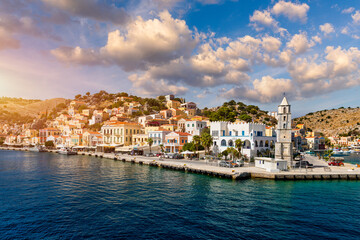 Fototapeta na wymiar View of the beautiful greek island of Symi (Simi) with colourful houses and small boats. Greece, Symi island, view of the town of Symi (near Rhodes), Dodecanese.