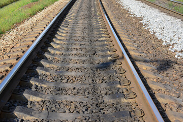 railway isolated going forward in sunny day, close-up 
