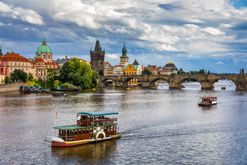 Fototapeta premium Charles Bridge sunset view of the Old Town pier architecture, Charles Bridge over Vltava river in Prague, Czechia. Old Town of Prague with Charles Bridge, Prague, Czech Republic.