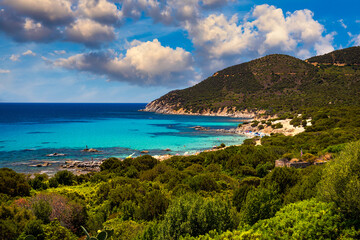 The beautiful turquoise water and white sand of Piscadeddus Beach, near Villasimius, Sardinia. The beautiful turquoise water and white sand of Piscadeddus Beach, near Villasimius, Sardinia.