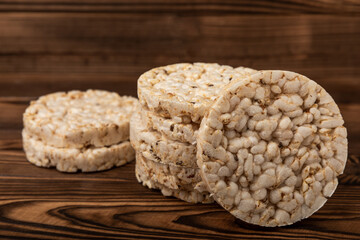 Rice cakes on an old brown tree. Diet bread. Useful food. Diet food. Gluten free. Space for copy. Space for text.