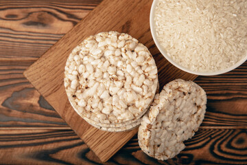 Rice cakes on an old brown tree. Diet bread. Useful food. Diet food. Gluten free. Space for copy. Space for text.