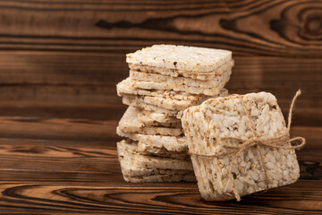 Rice cakes on an old brown tree. Diet bread. Useful food. Diet food. Gluten free. Space for copy. Space for text.