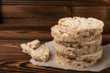 Rice cakes on an old brown tree. Diet bread. Useful food. Diet food. Gluten free. Space for copy. Space for text.