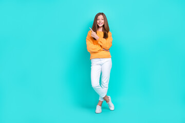 Fototapeta na wymiar Full body size photo of young child girl wear stylish outfit finger point new shopping proposition cheap clothes isolated on cyan color background