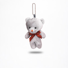 Teddy bear levitating on white background with shadow